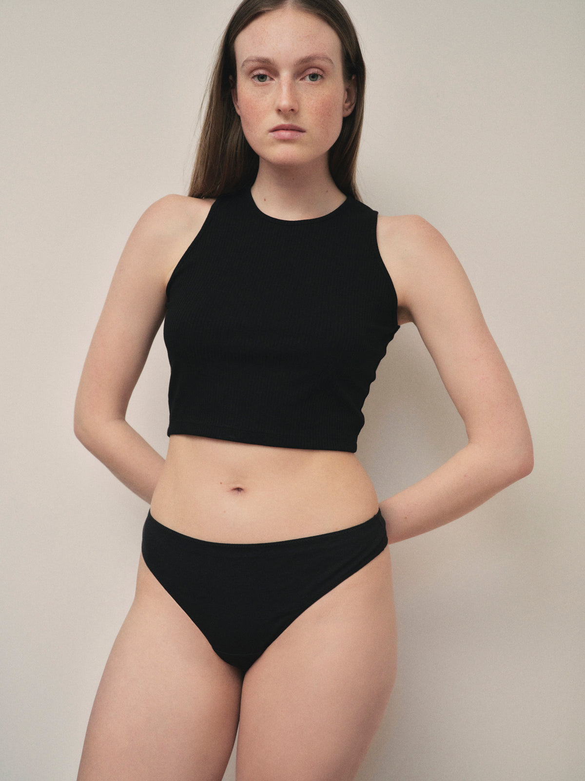 VIMERA organic Peruvian Pima cotton thong underwear in Noir, front view on model.